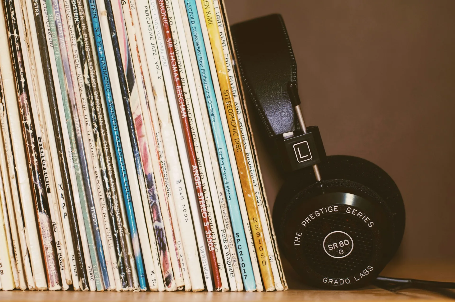 Stack of vinyl records with some audiophile headphones